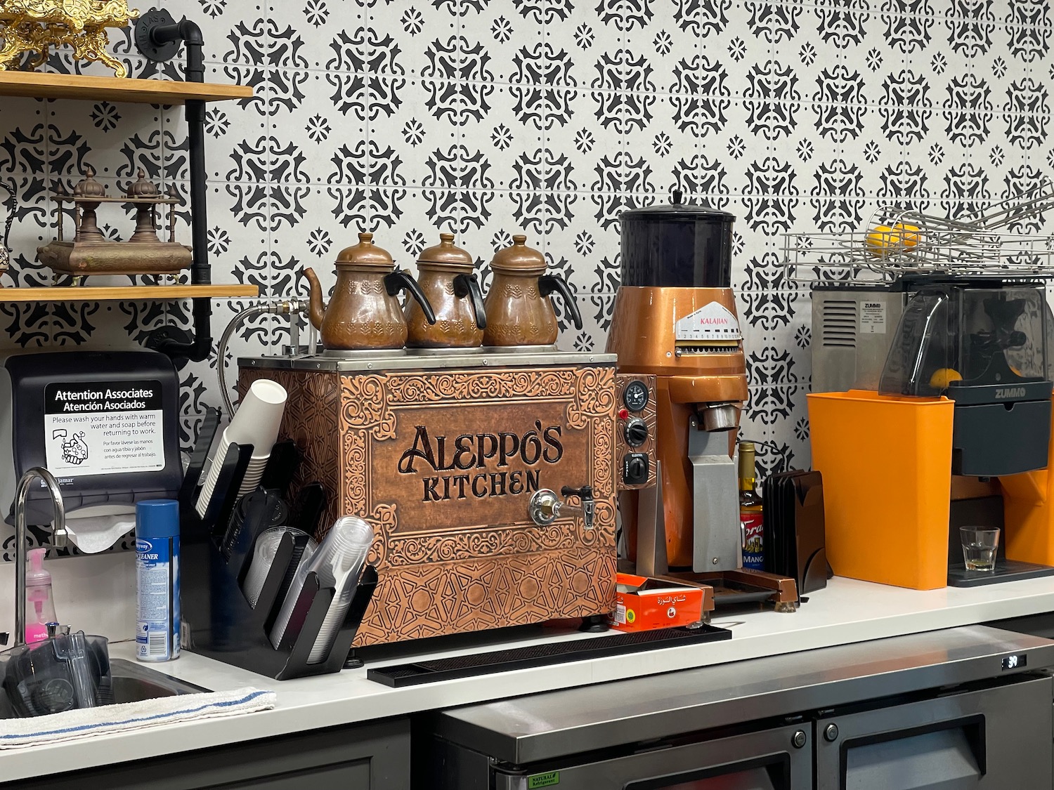 a coffee maker and coffee grinder on a counter