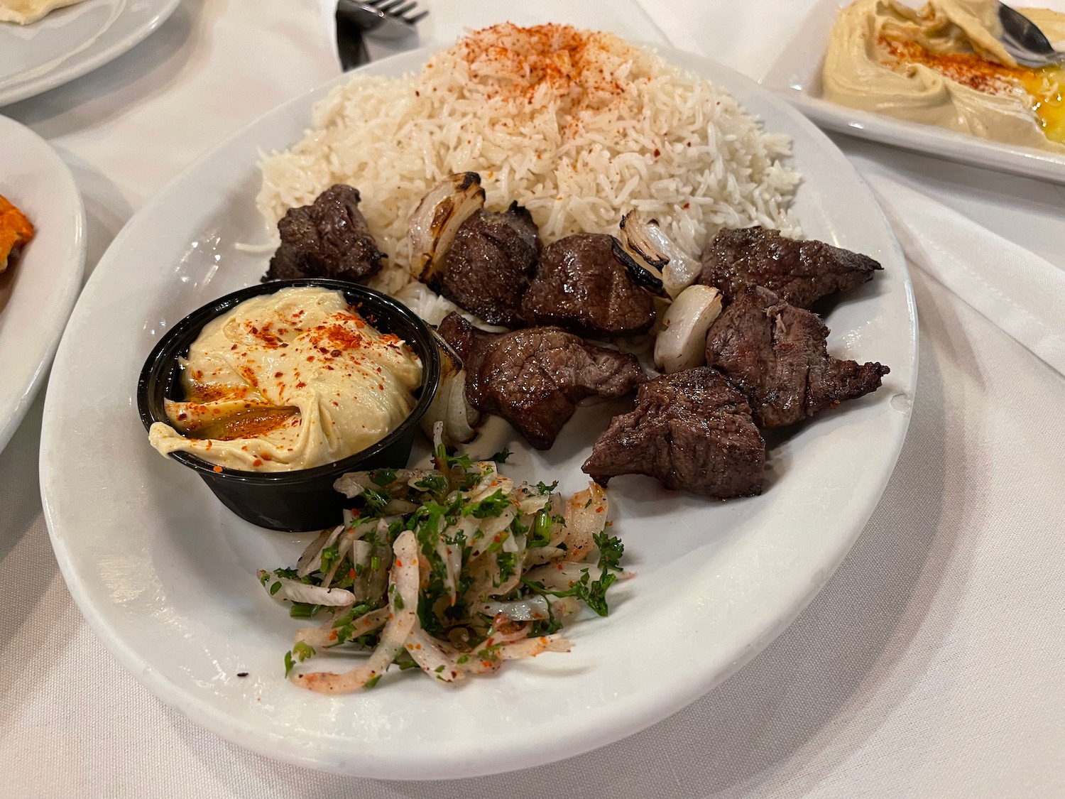 a plate of meat and rice