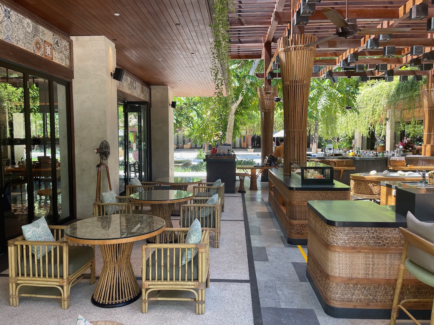 a patio with tables and chairs