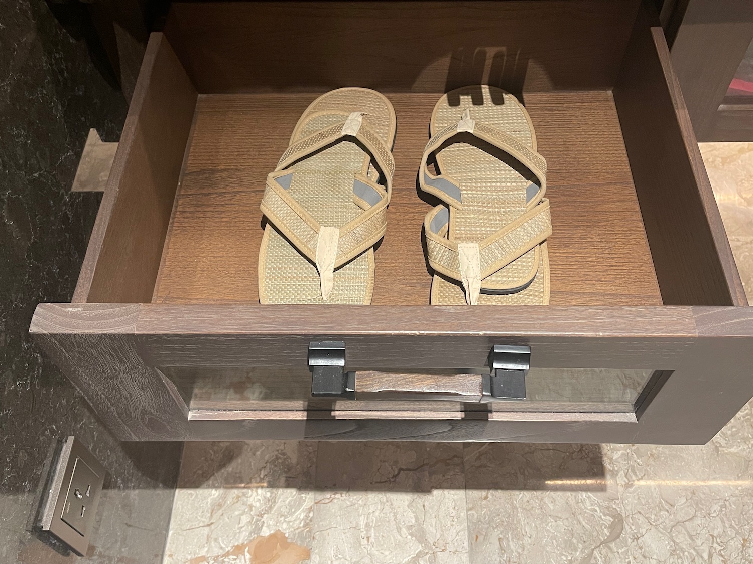 a pair of sandals in a drawer
