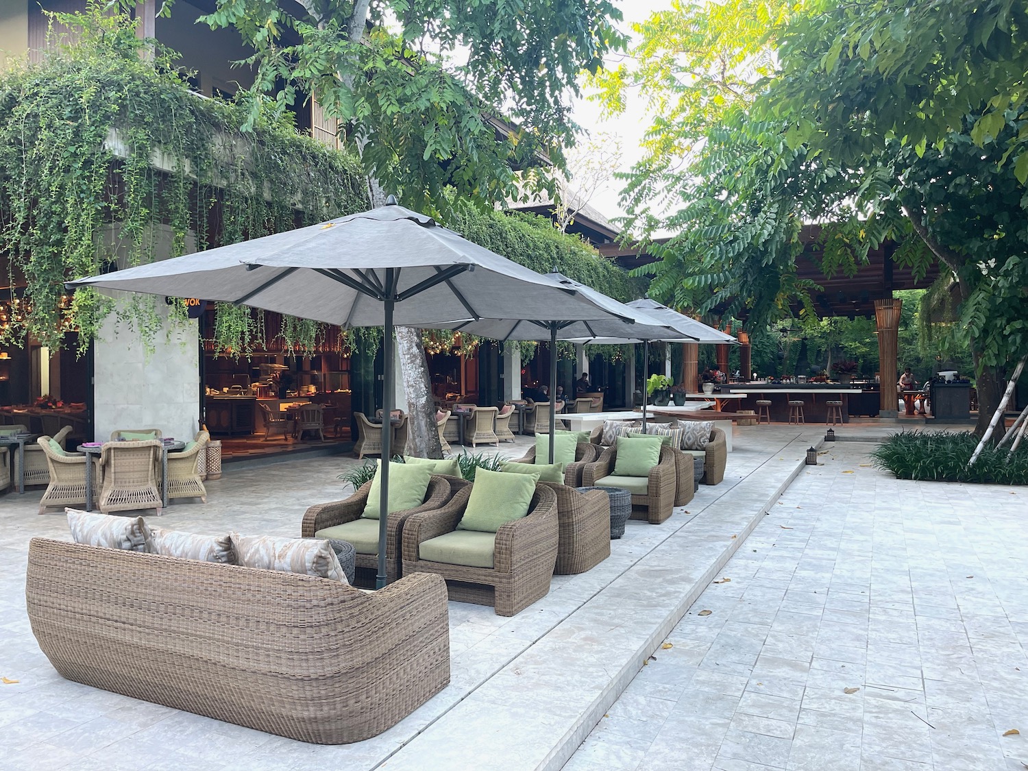 a patio with chairs and umbrellas