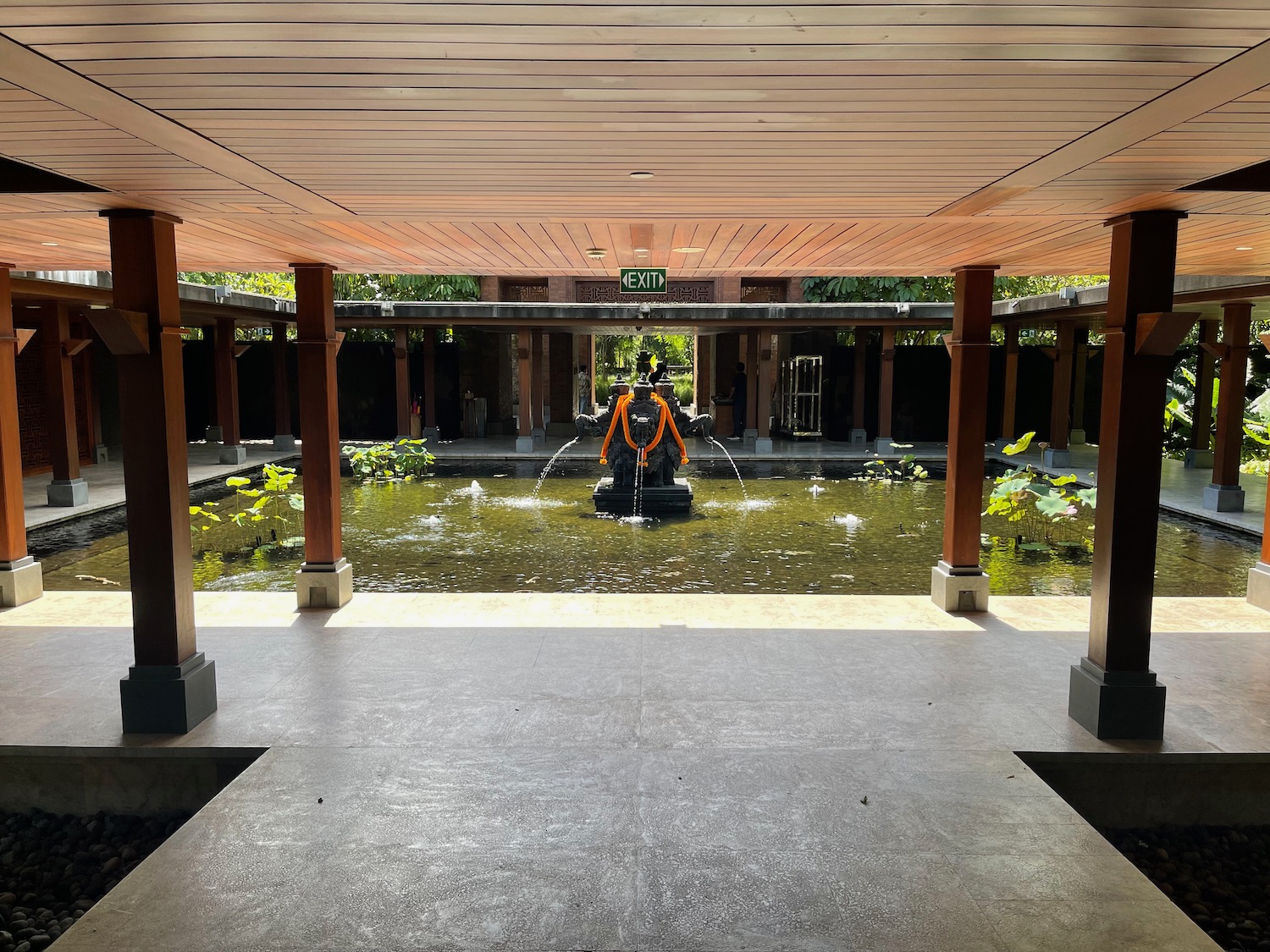 a person in an orange suit in a pond