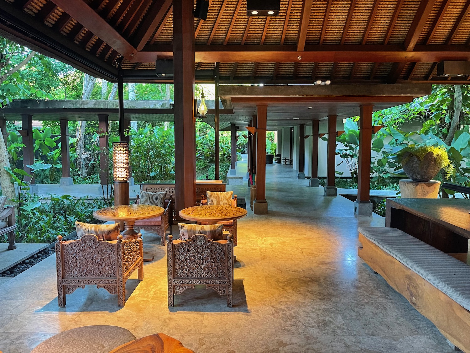 a patio with tables and chairs