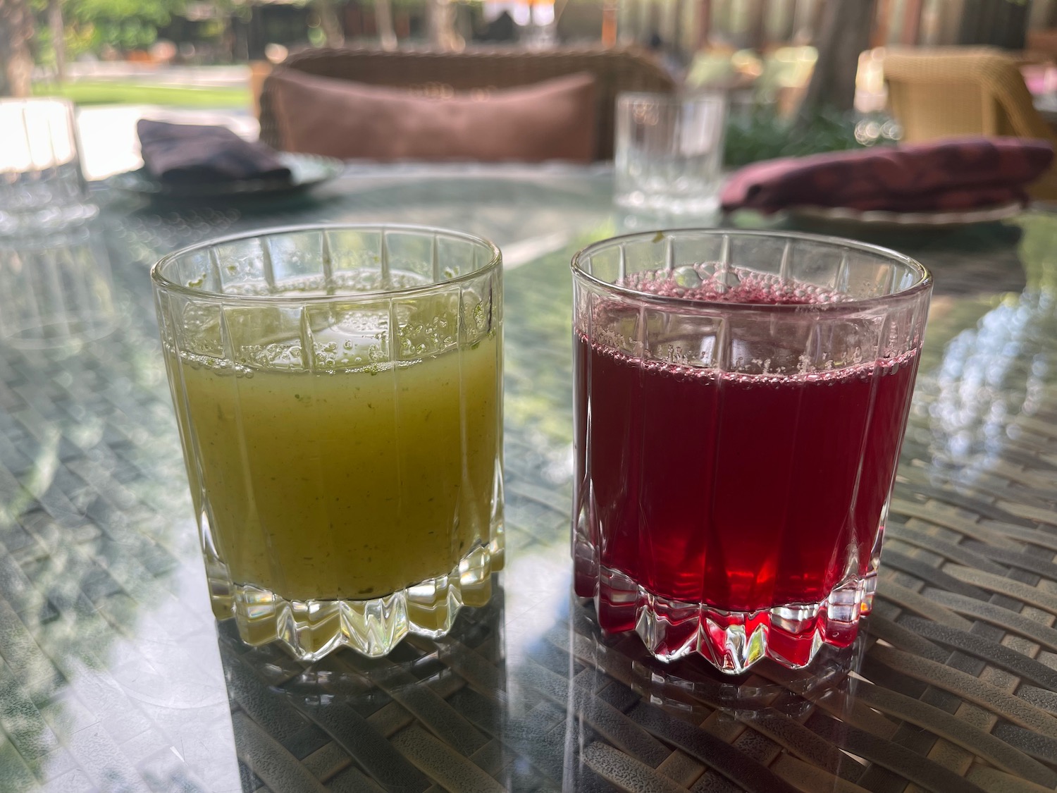 two glasses of juice on a table