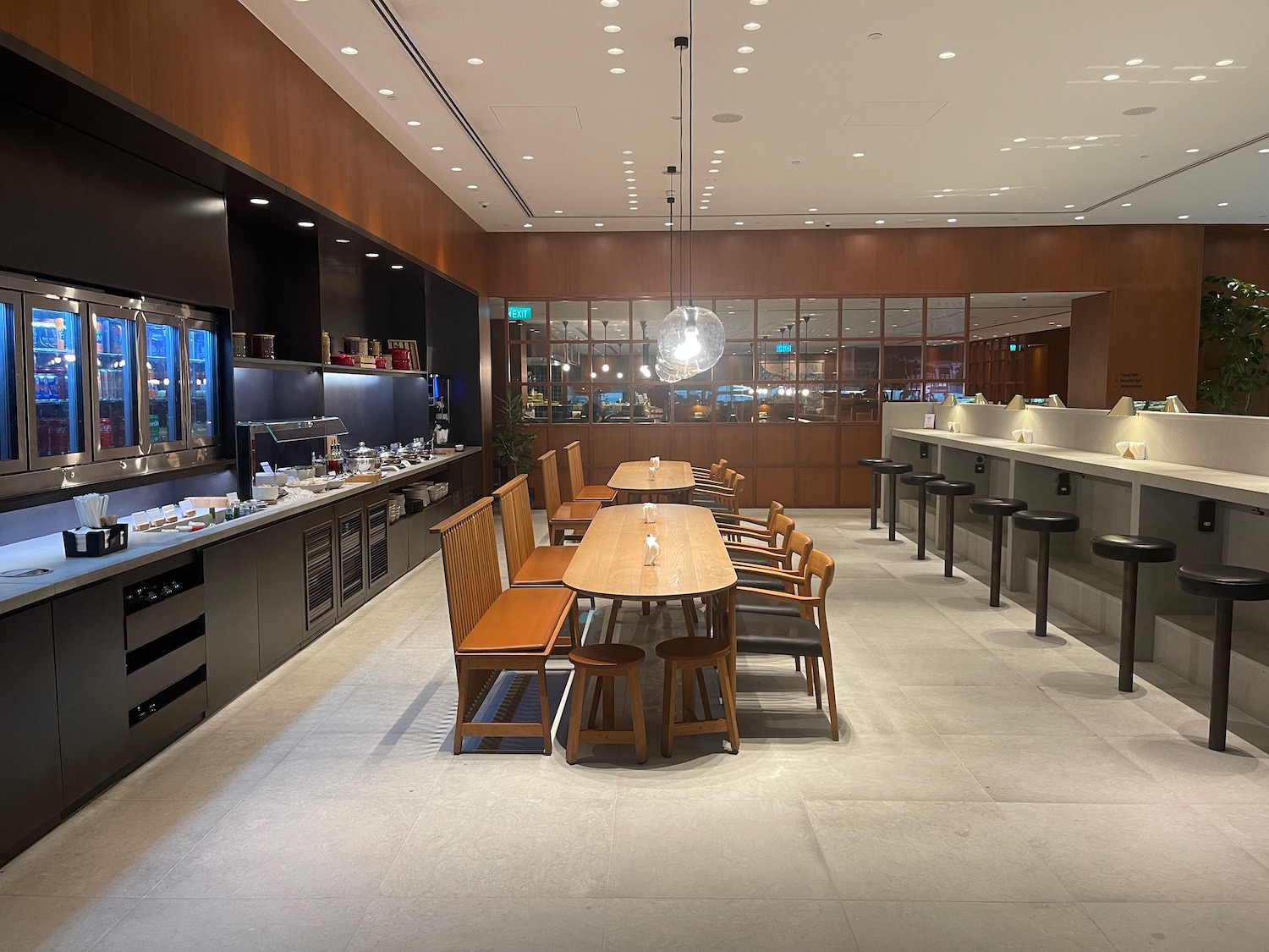 a restaurant with a long table and chairs