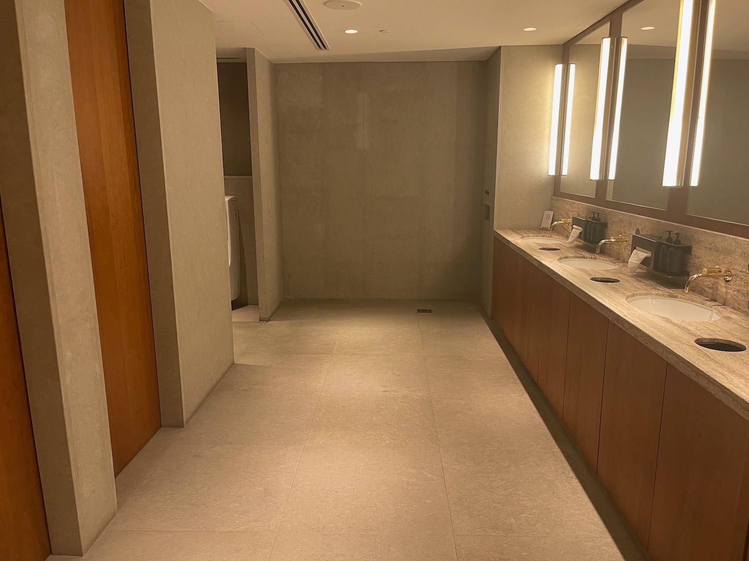 a bathroom with a large mirror and sink