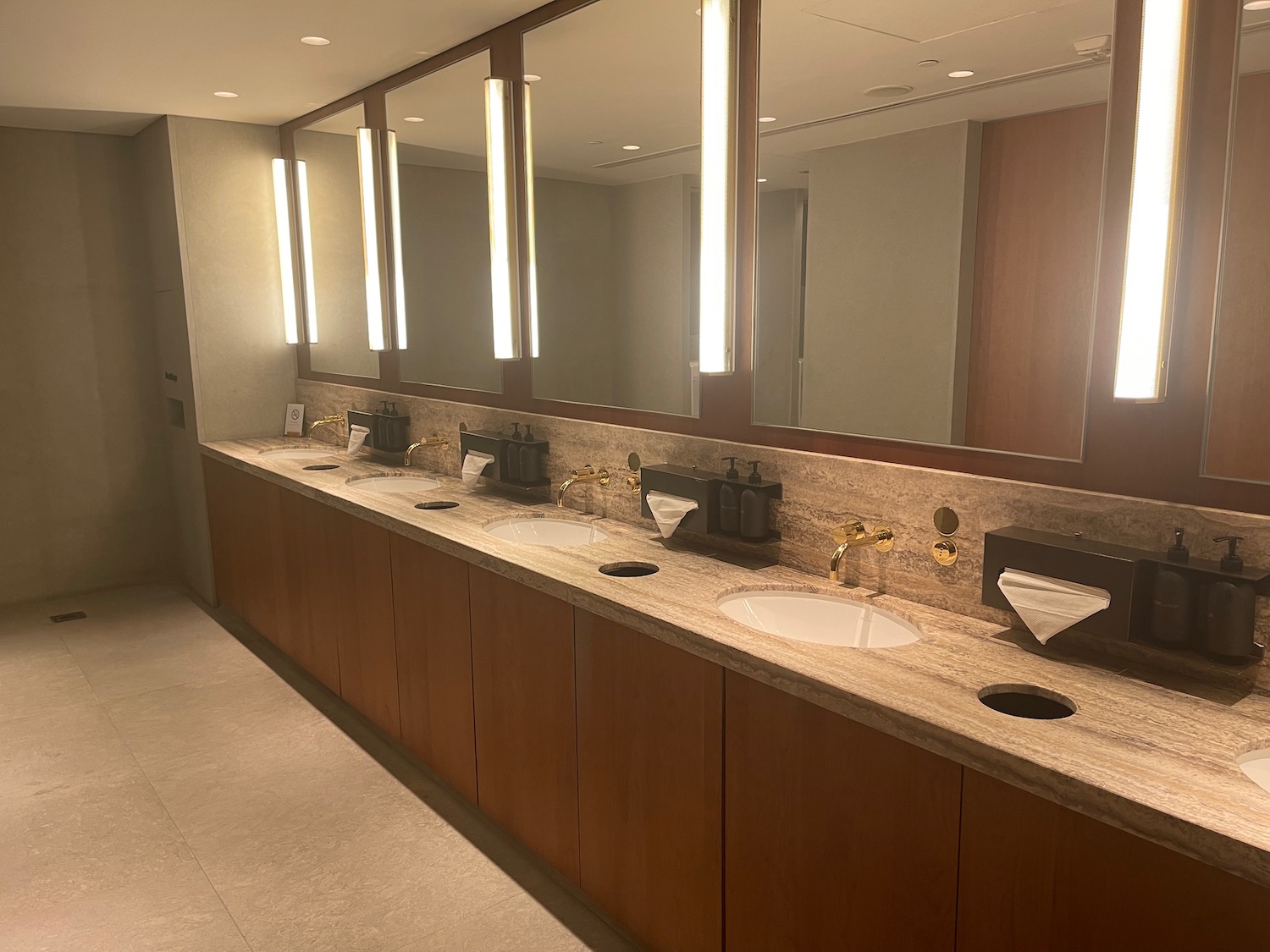 a bathroom with sinks and mirrors