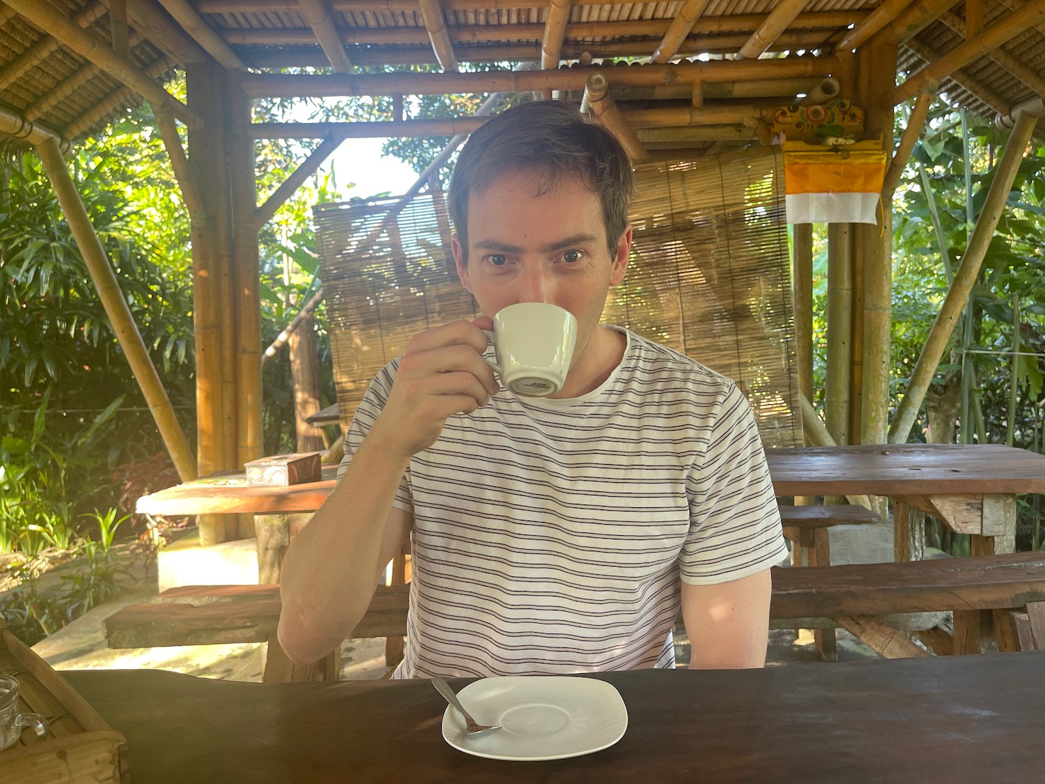 a man drinking from a cup