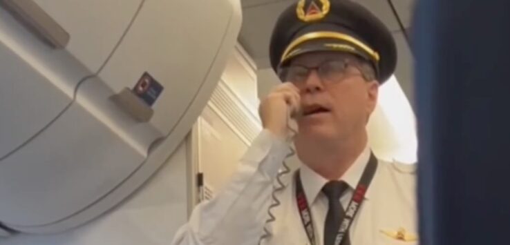 a man in a uniform talking on a phone