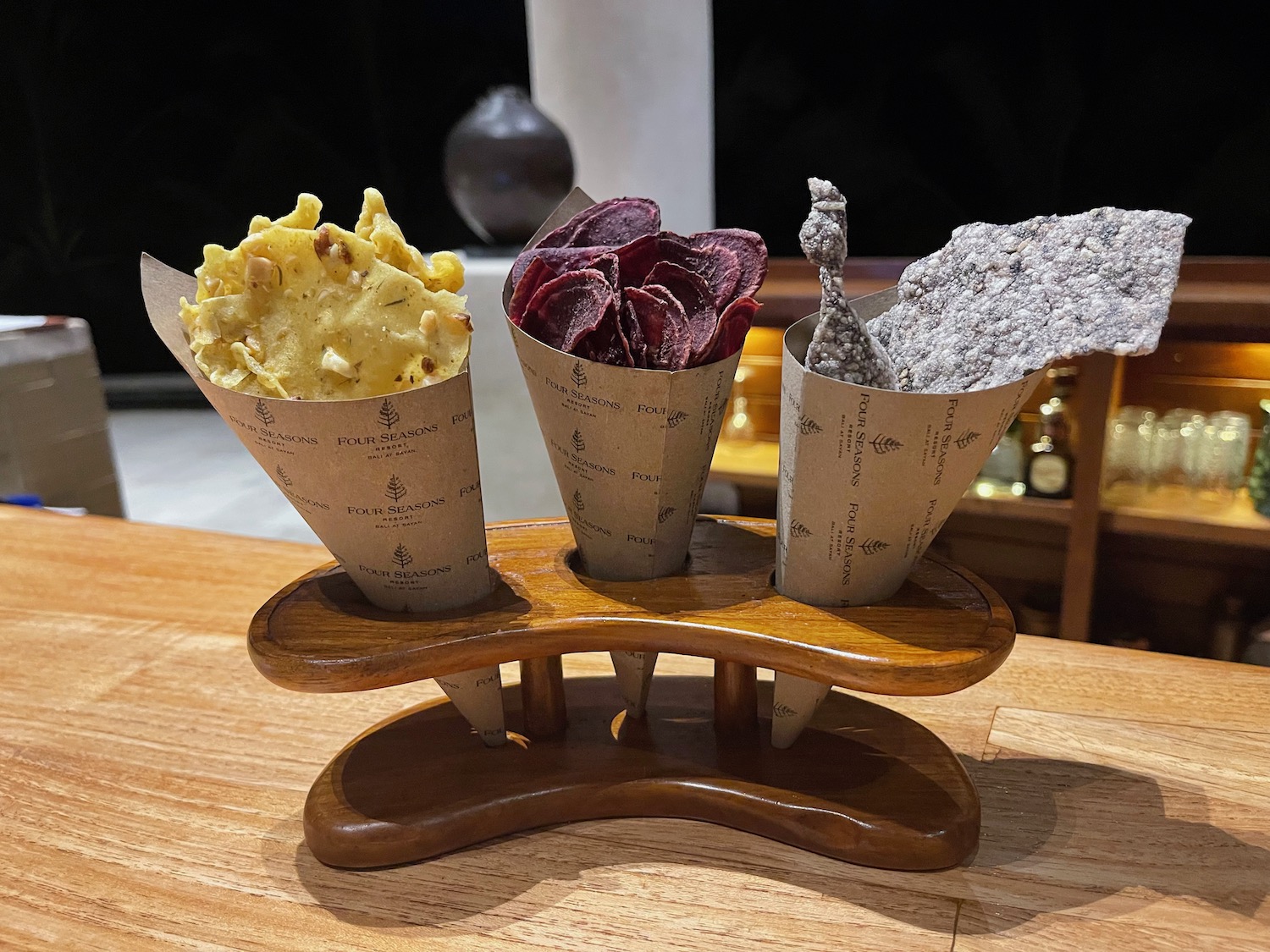 a group of chips in cones on a wood stand