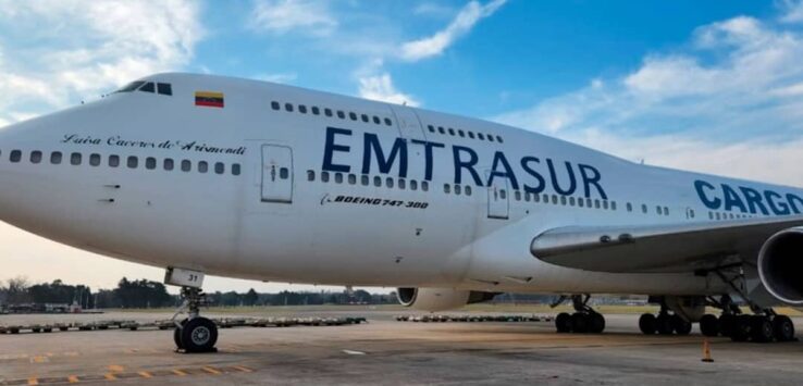 a large white airplane on a runway