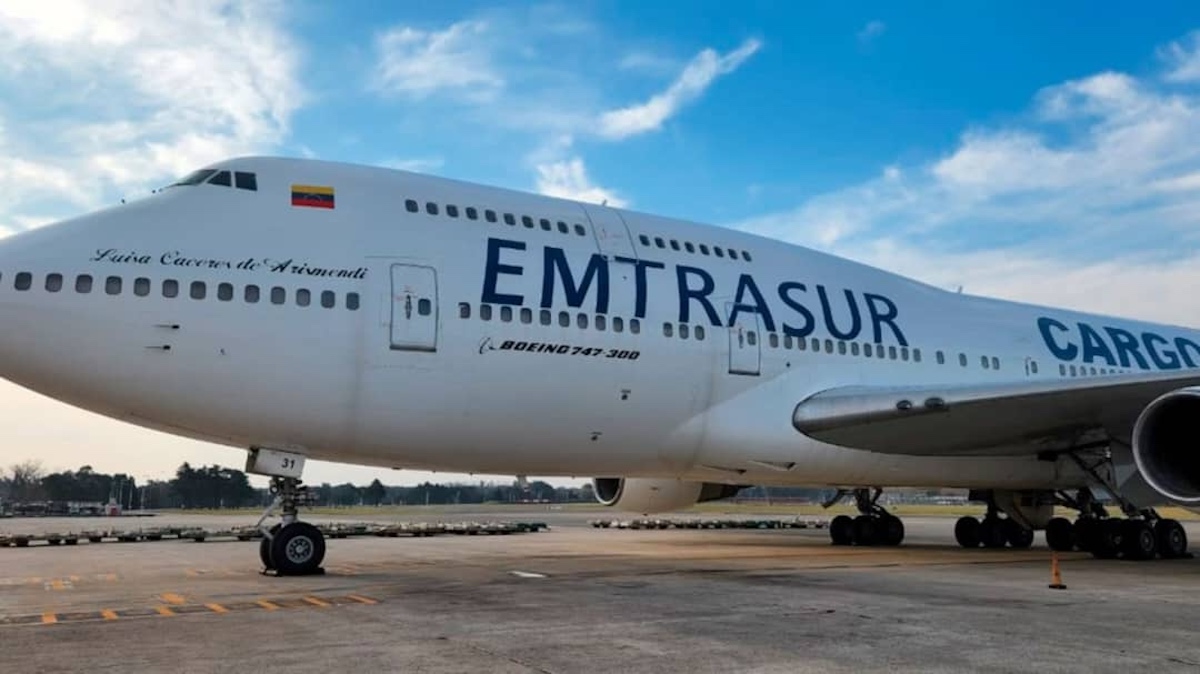 a large white airplane on a runway