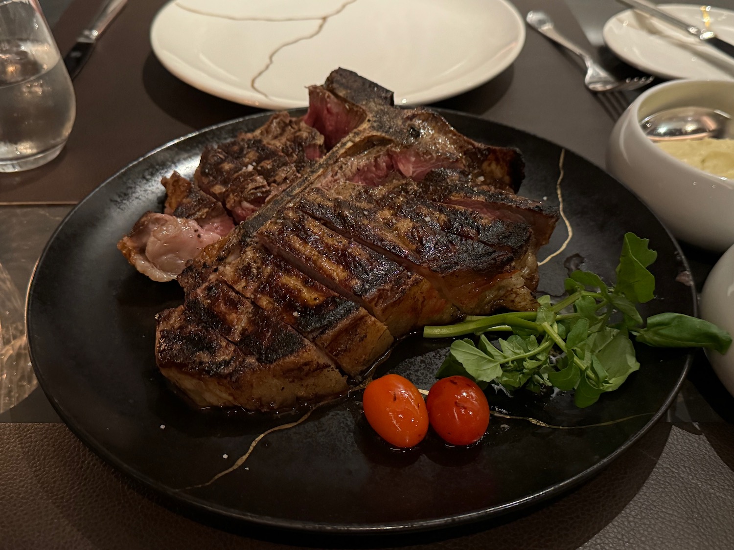 a plate of steak and vegetables