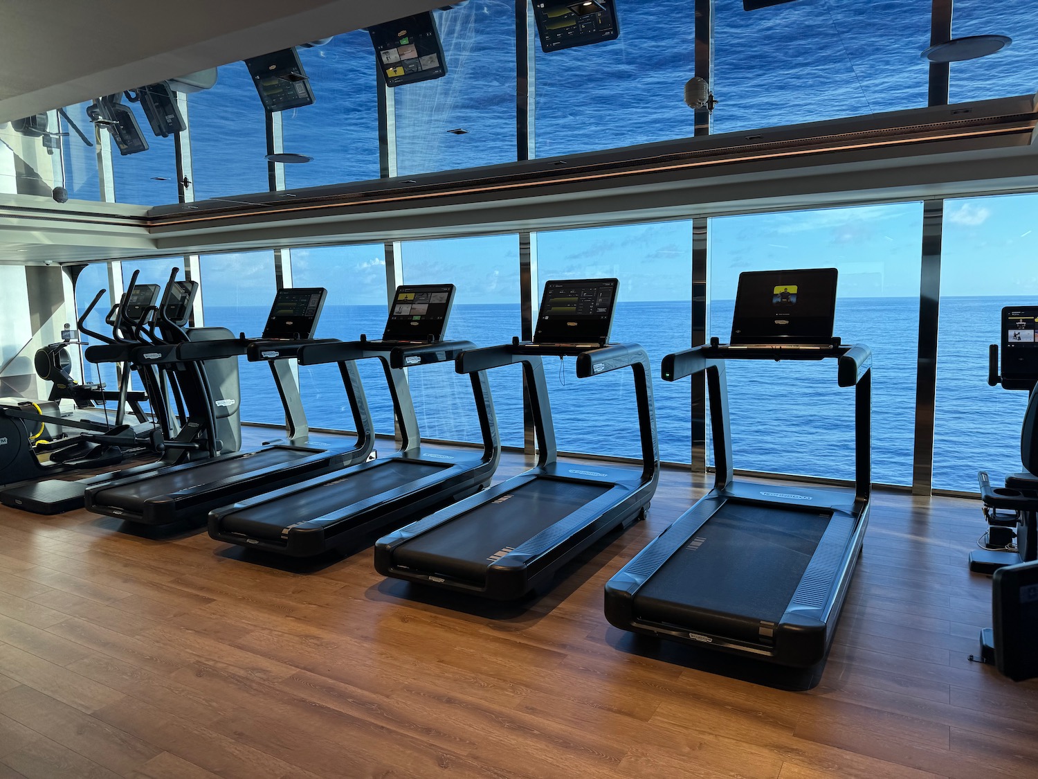 tread treadmills in a room with a large window