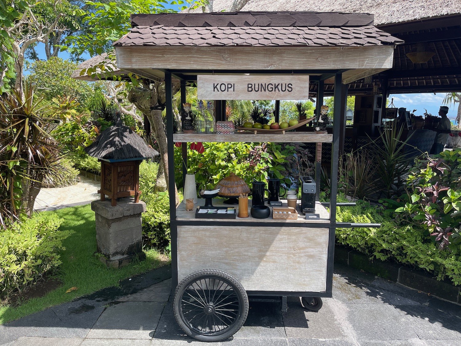 a food cart with a sign on it