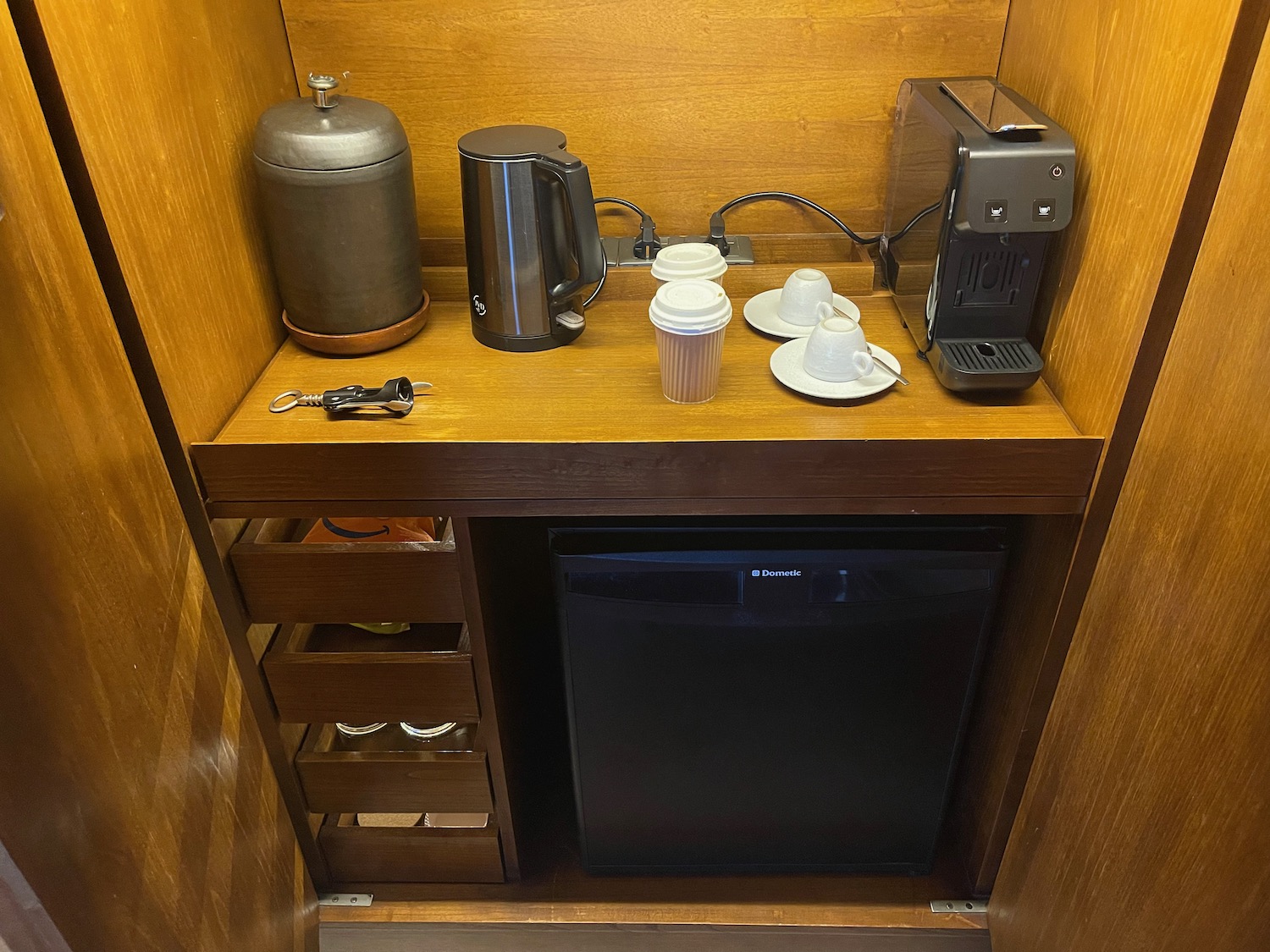a coffee maker and coffee pot on a counter