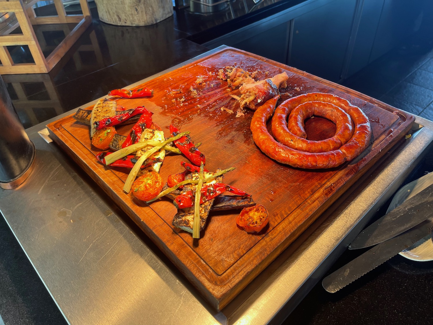 a cutting board with different types of meat on it