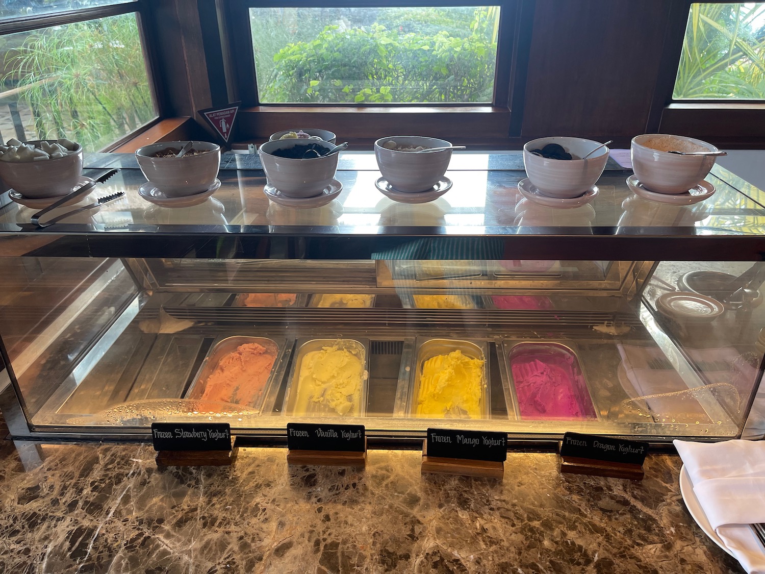 a display case with different colored ice cream