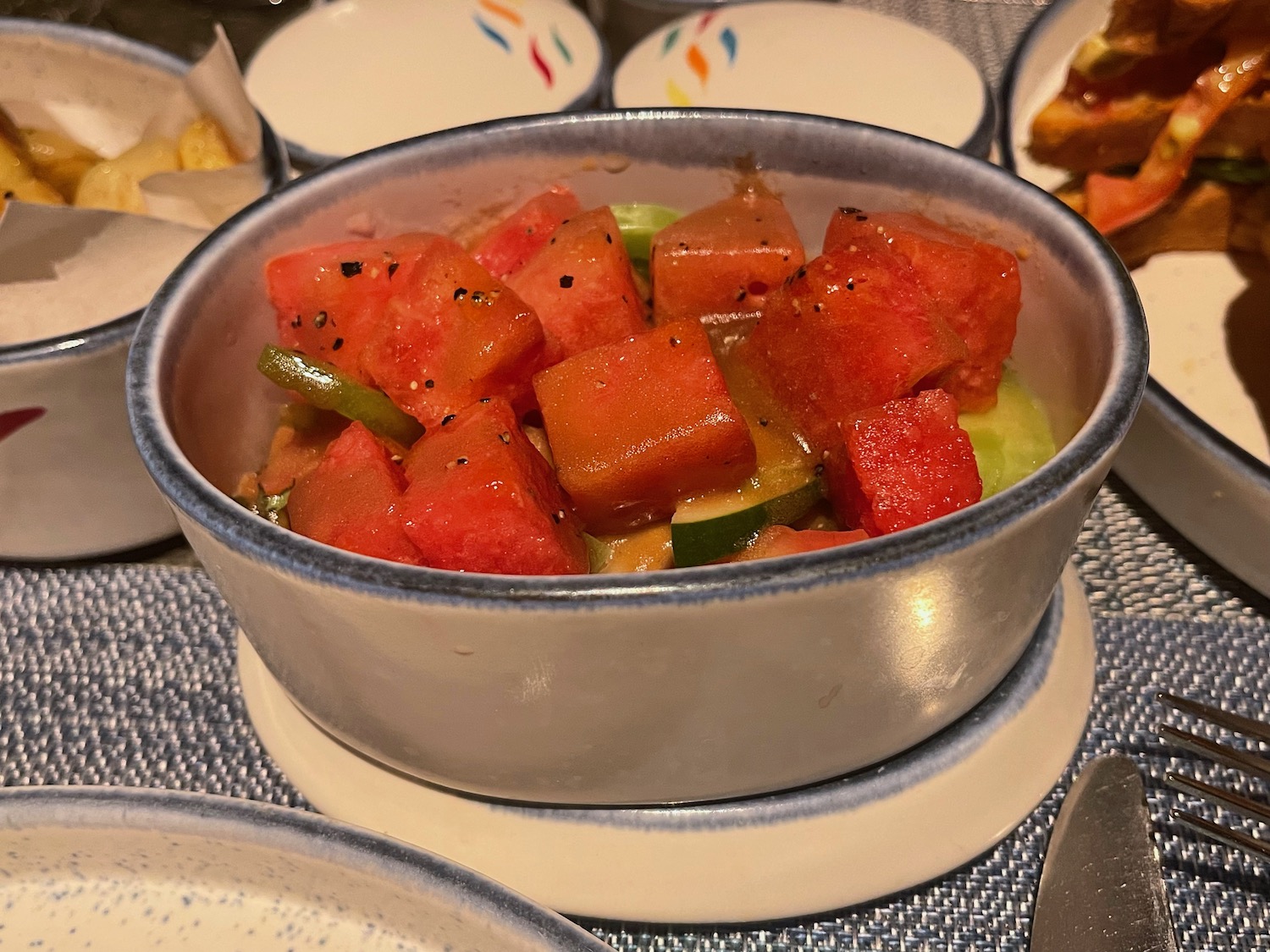 a bowl of watermelon and vegetables
