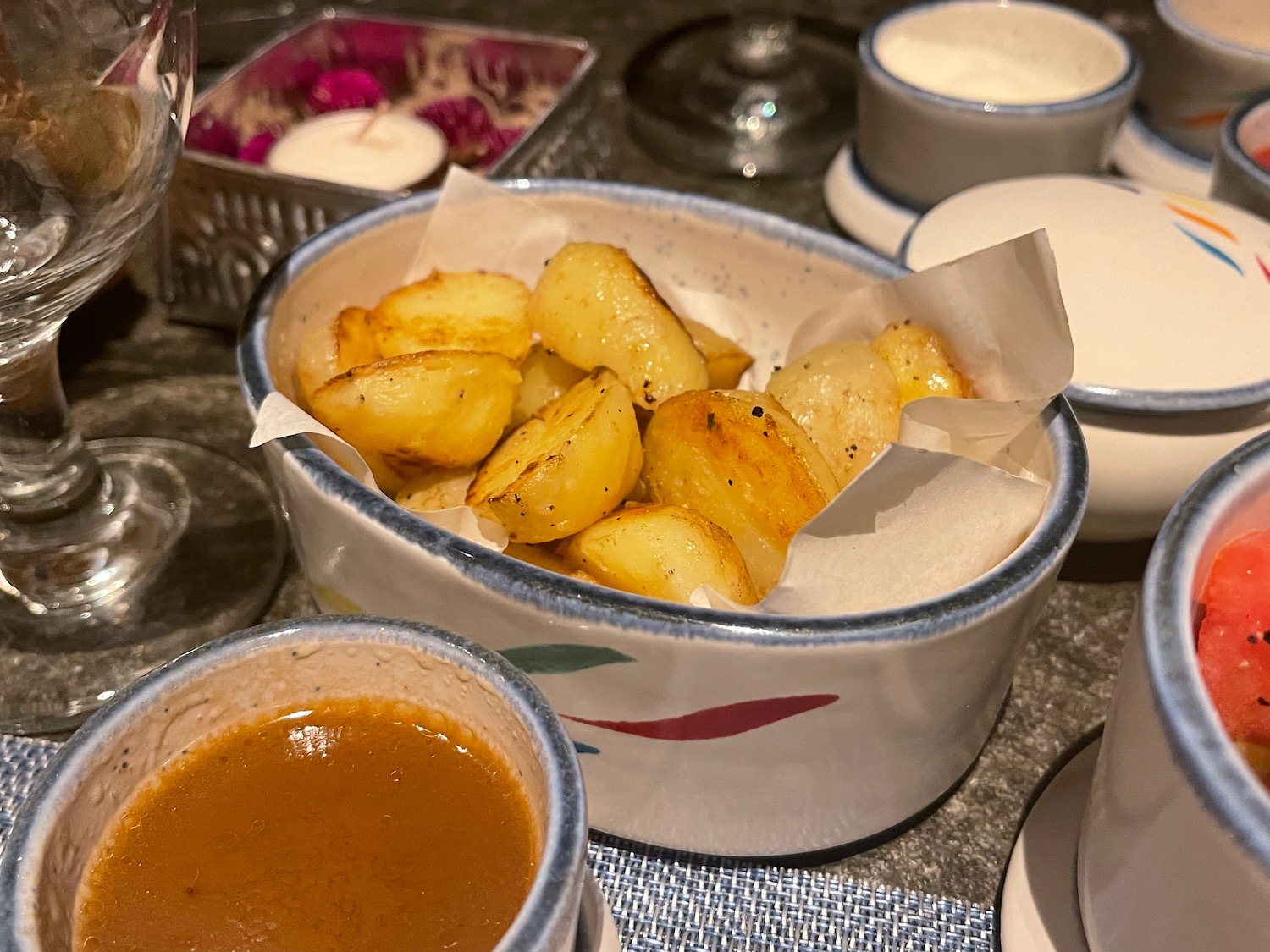 a bowl of potatoes with sauce