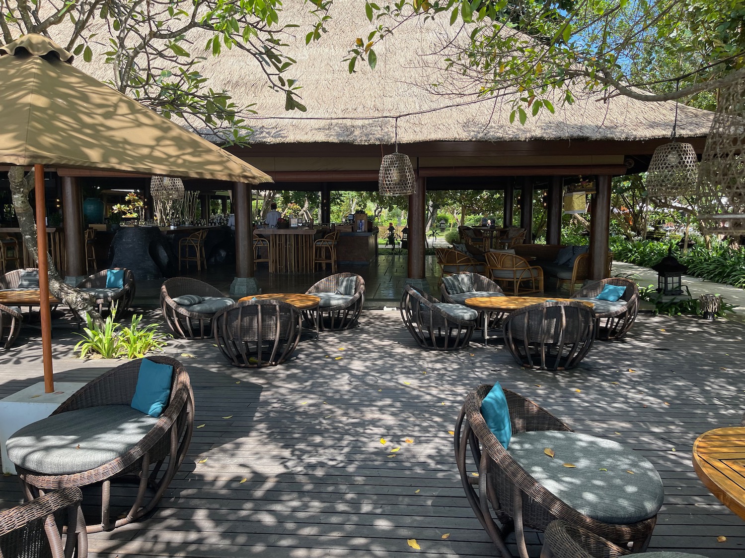 a patio with chairs and tables