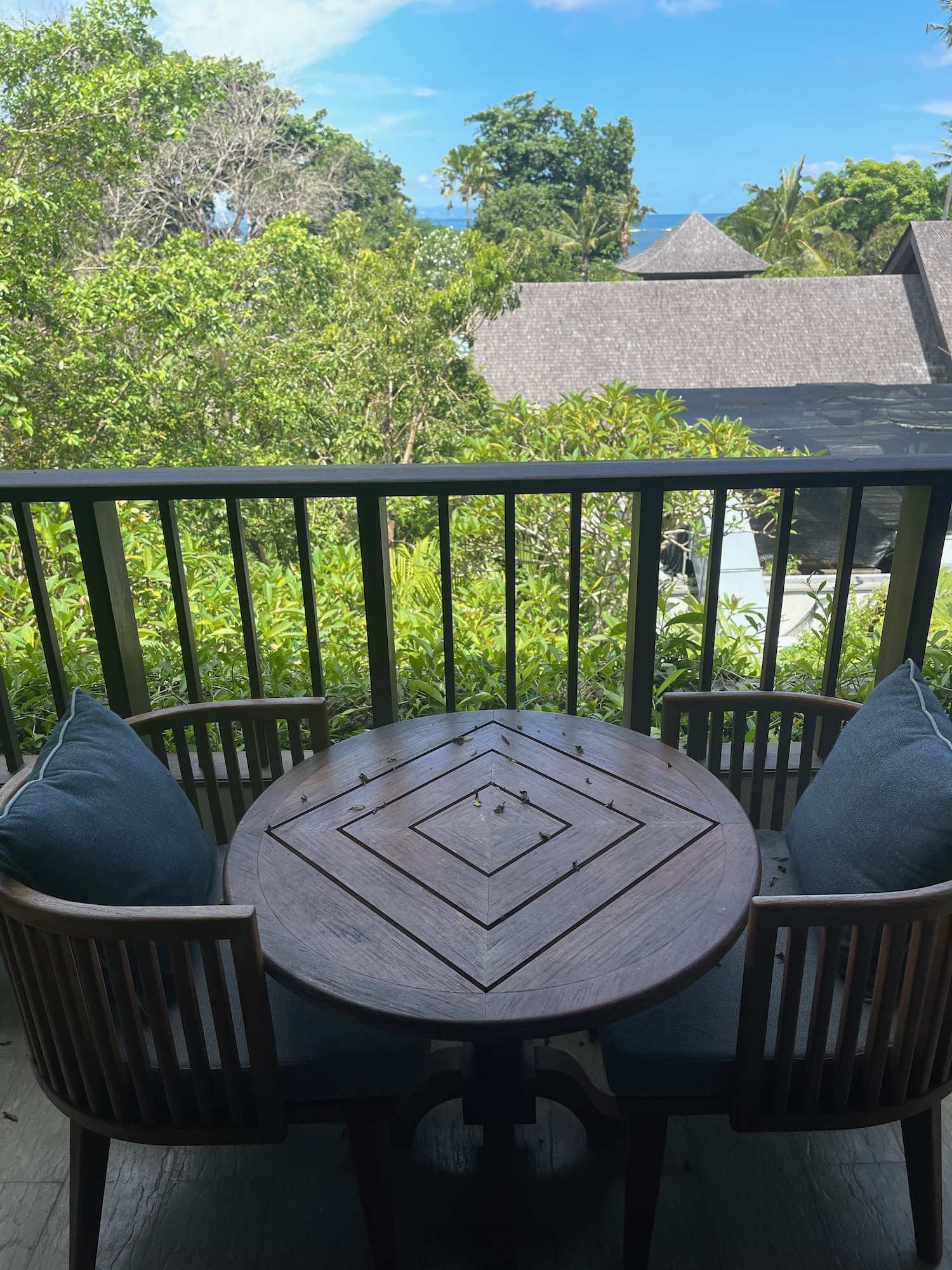 a table and chairs on a deck