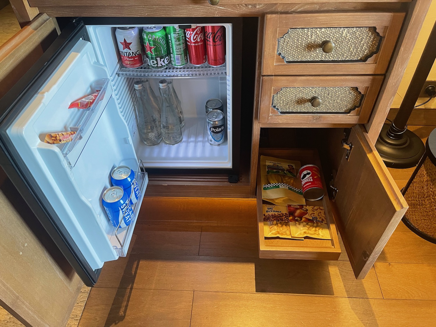 a mini fridge with drinks and snacks