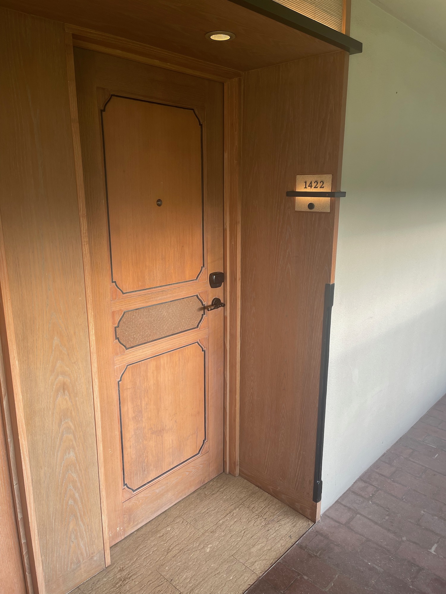 a wooden door with a number on the door