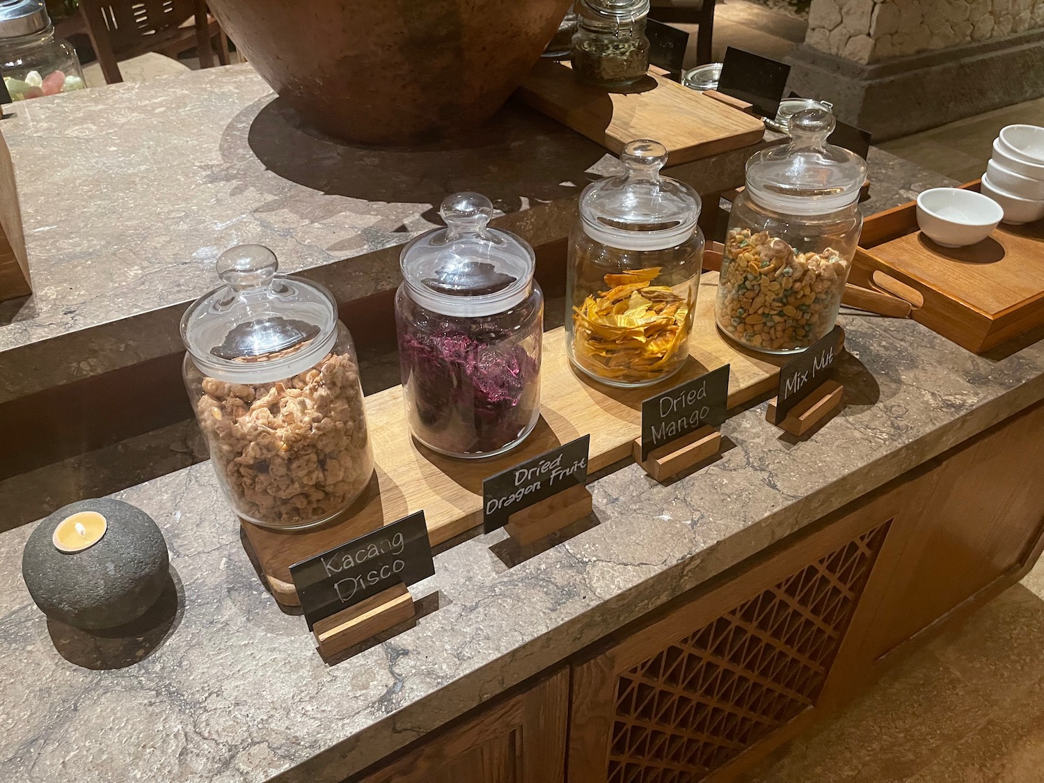 a group of glass jars with labels on a counter
