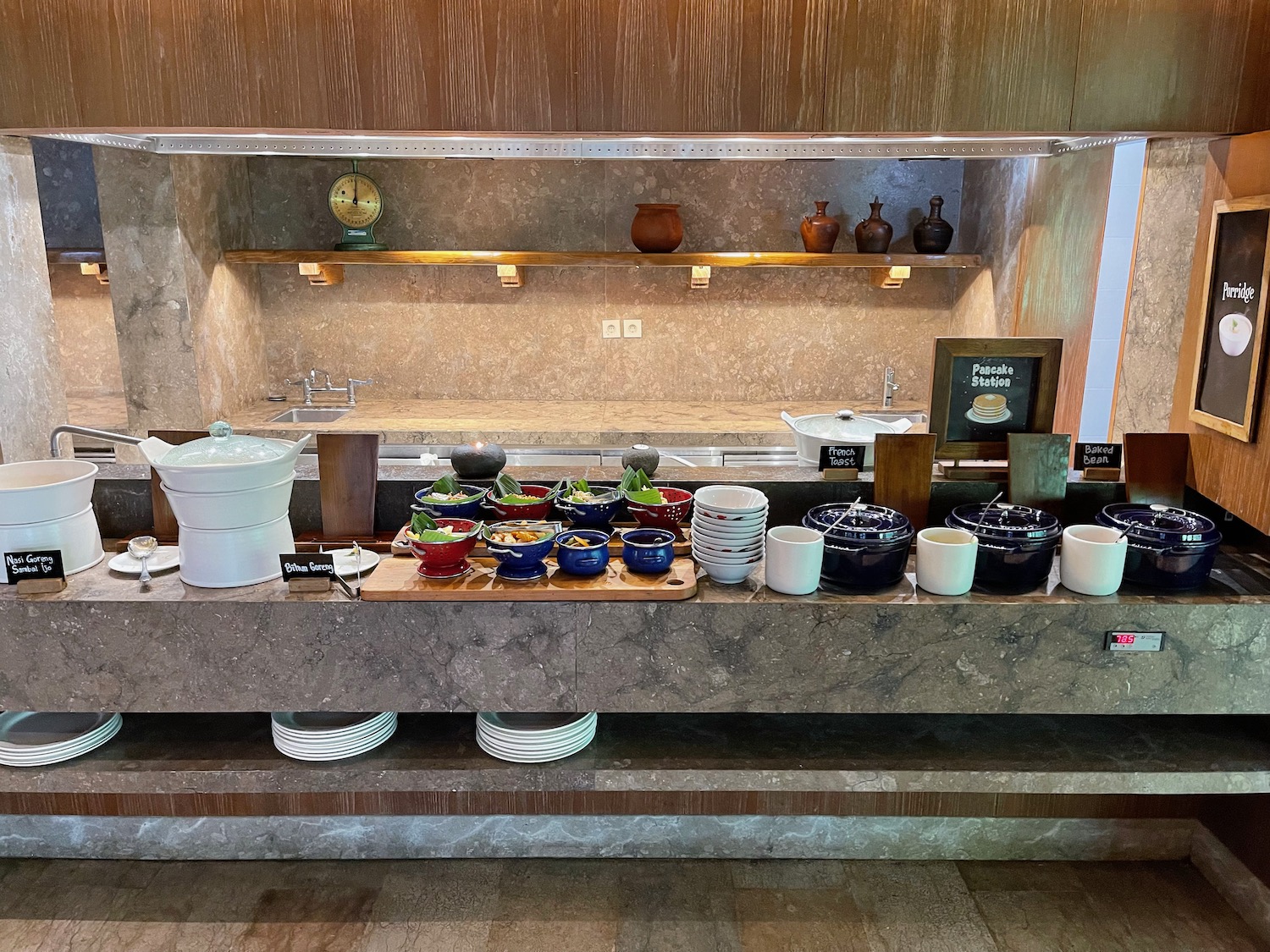 a kitchen with a counter top and bowls of food