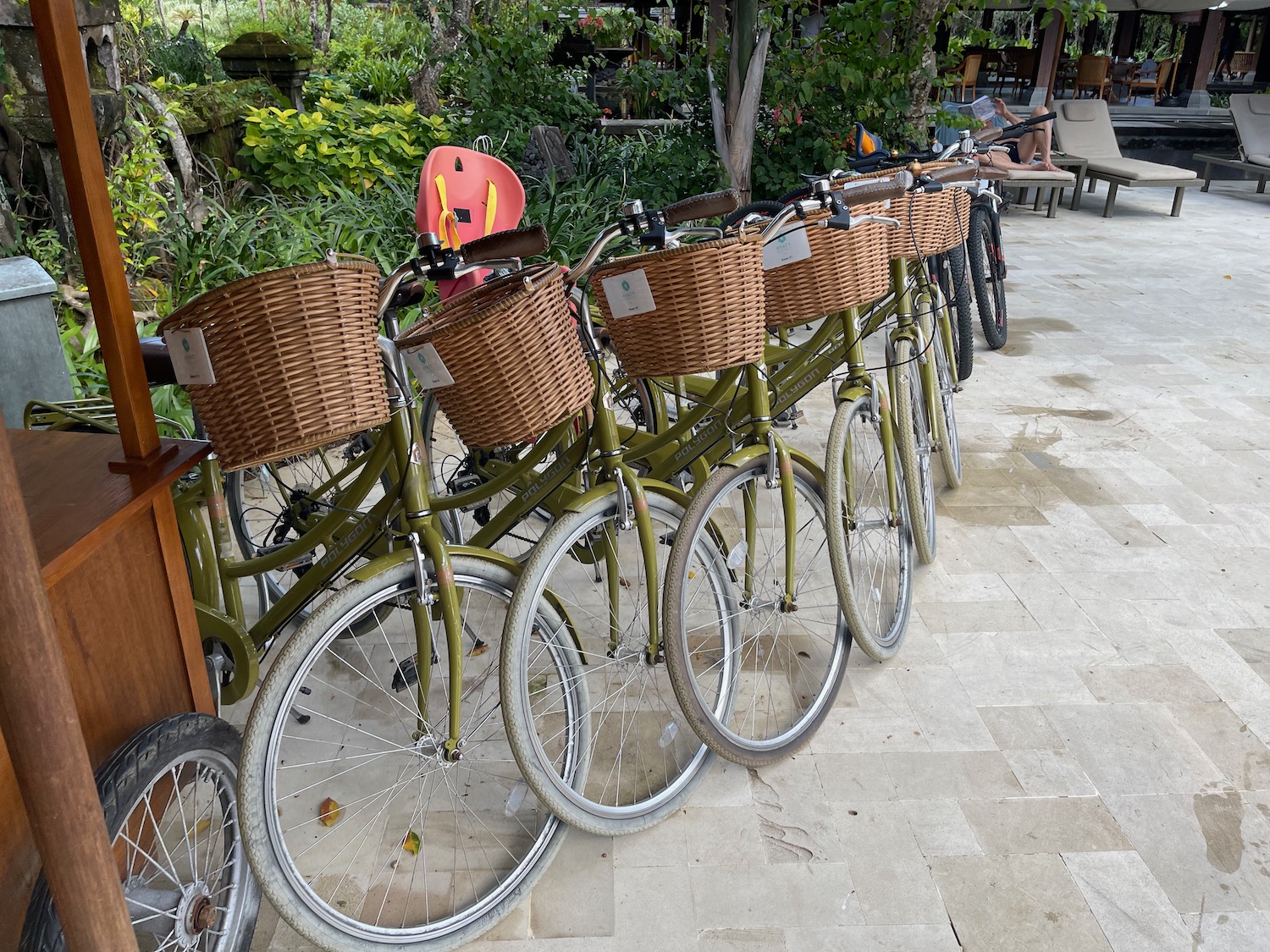 a row of bicycles with baskets