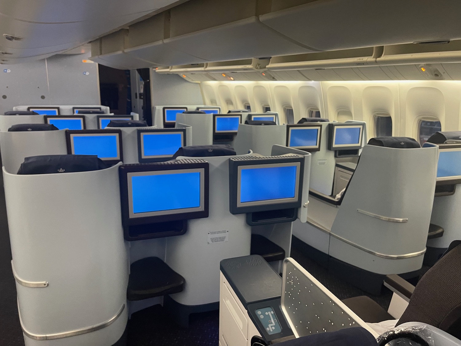 a row of monitors in an airplane