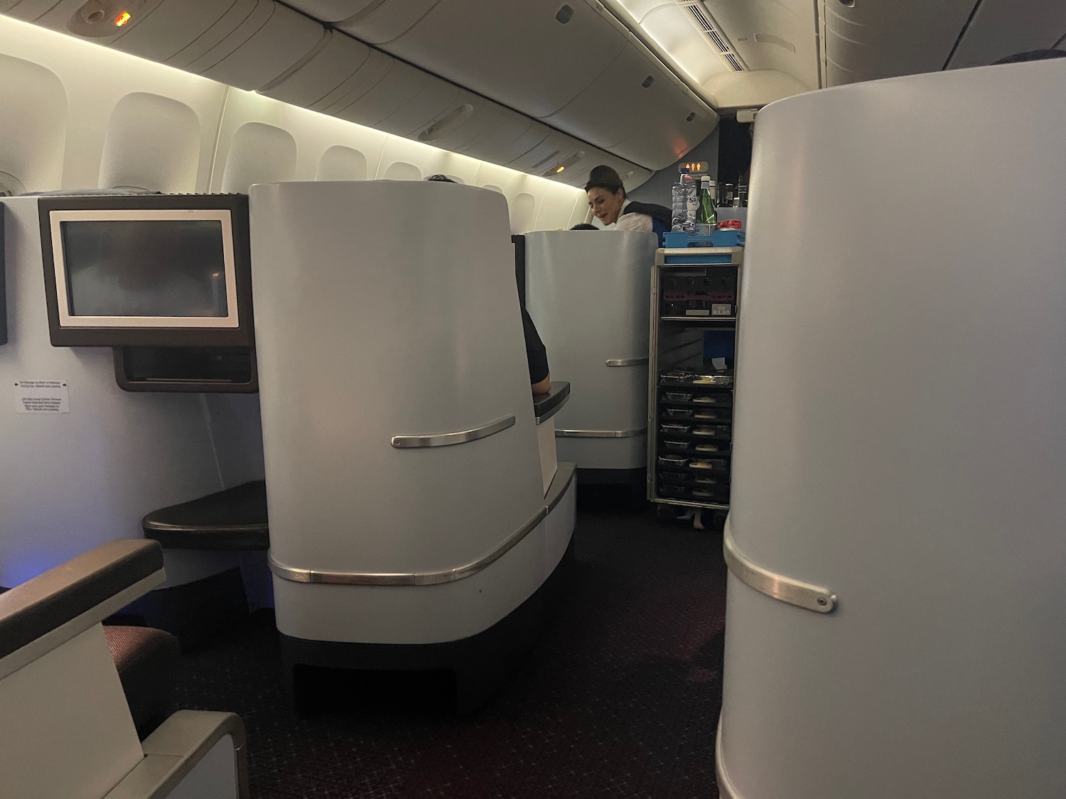 a person sitting at a desk in an airplane