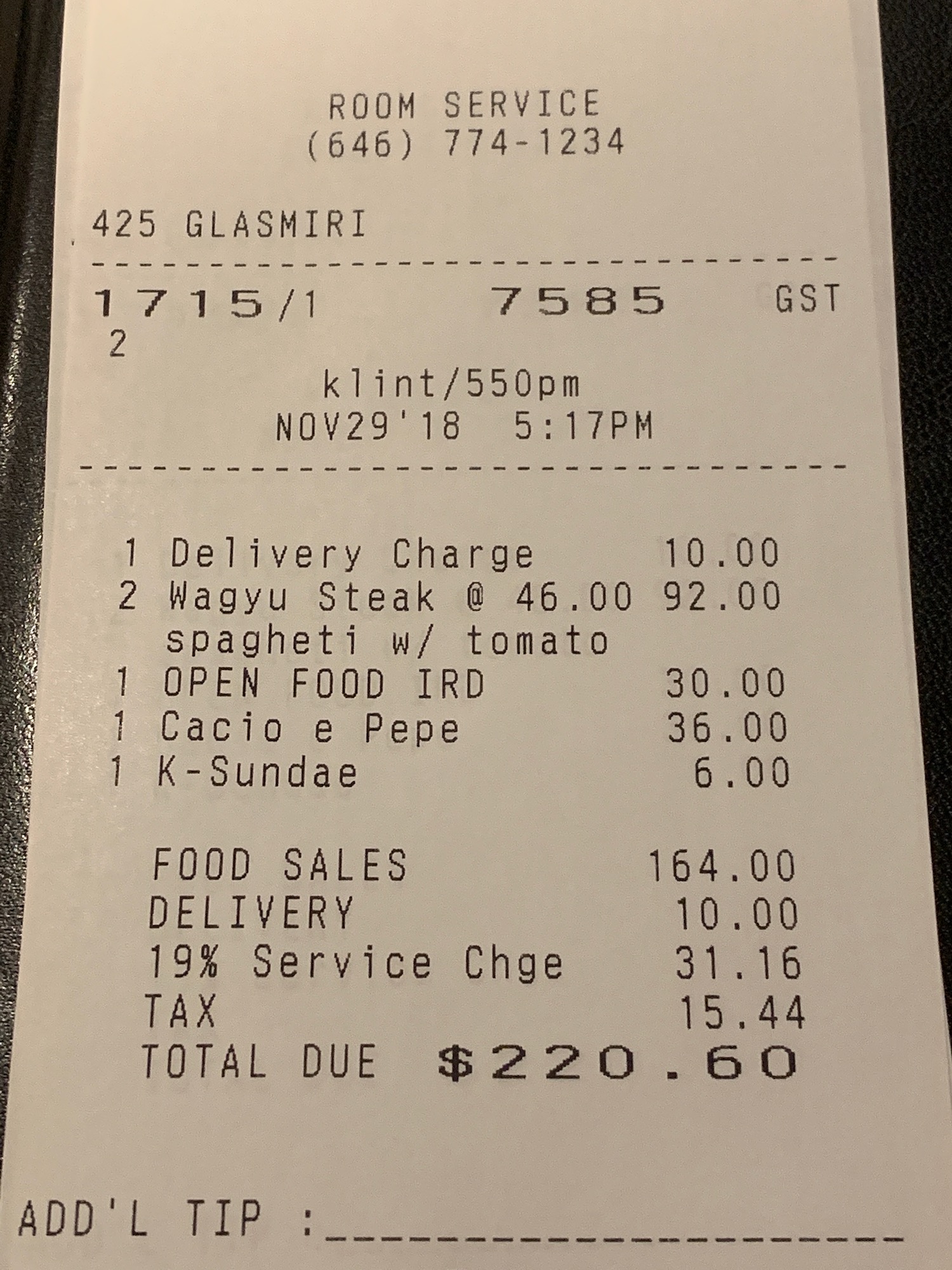 a receipt on a black surface