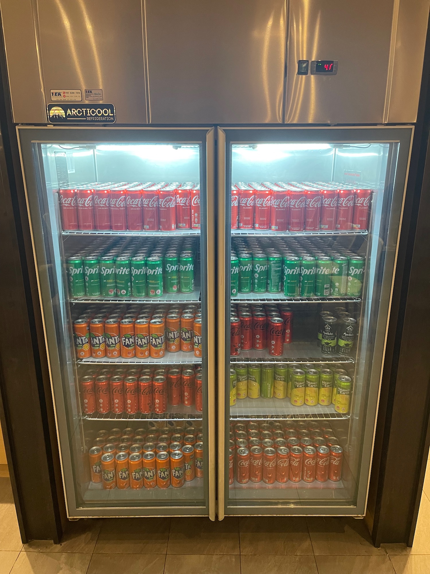 a refrigerator with cans of soda