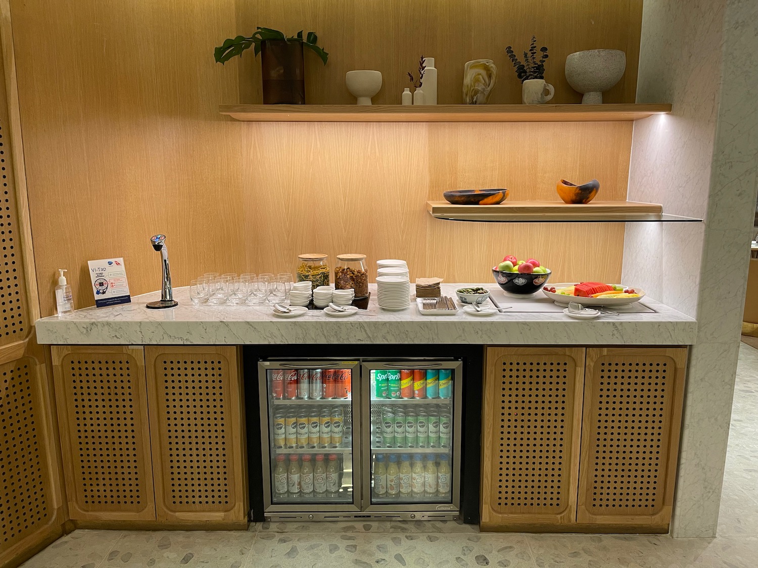 a counter with drinks and bowls on it
