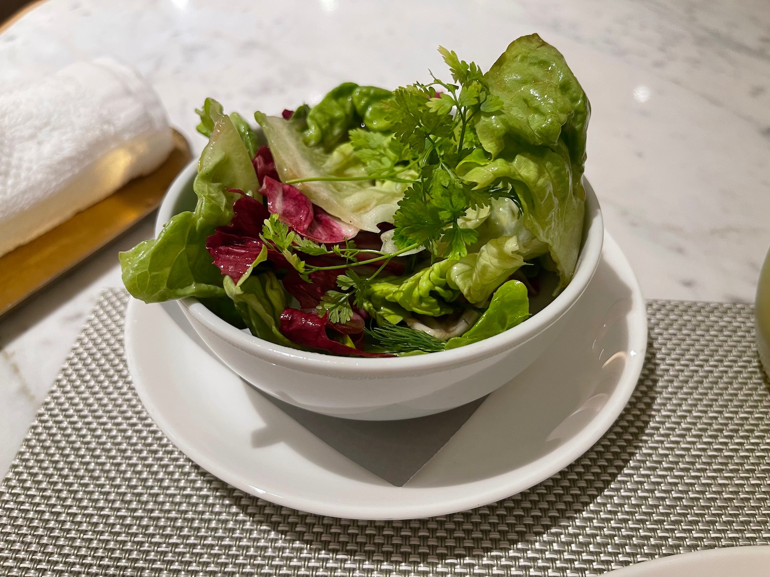 a bowl of salad on a plate