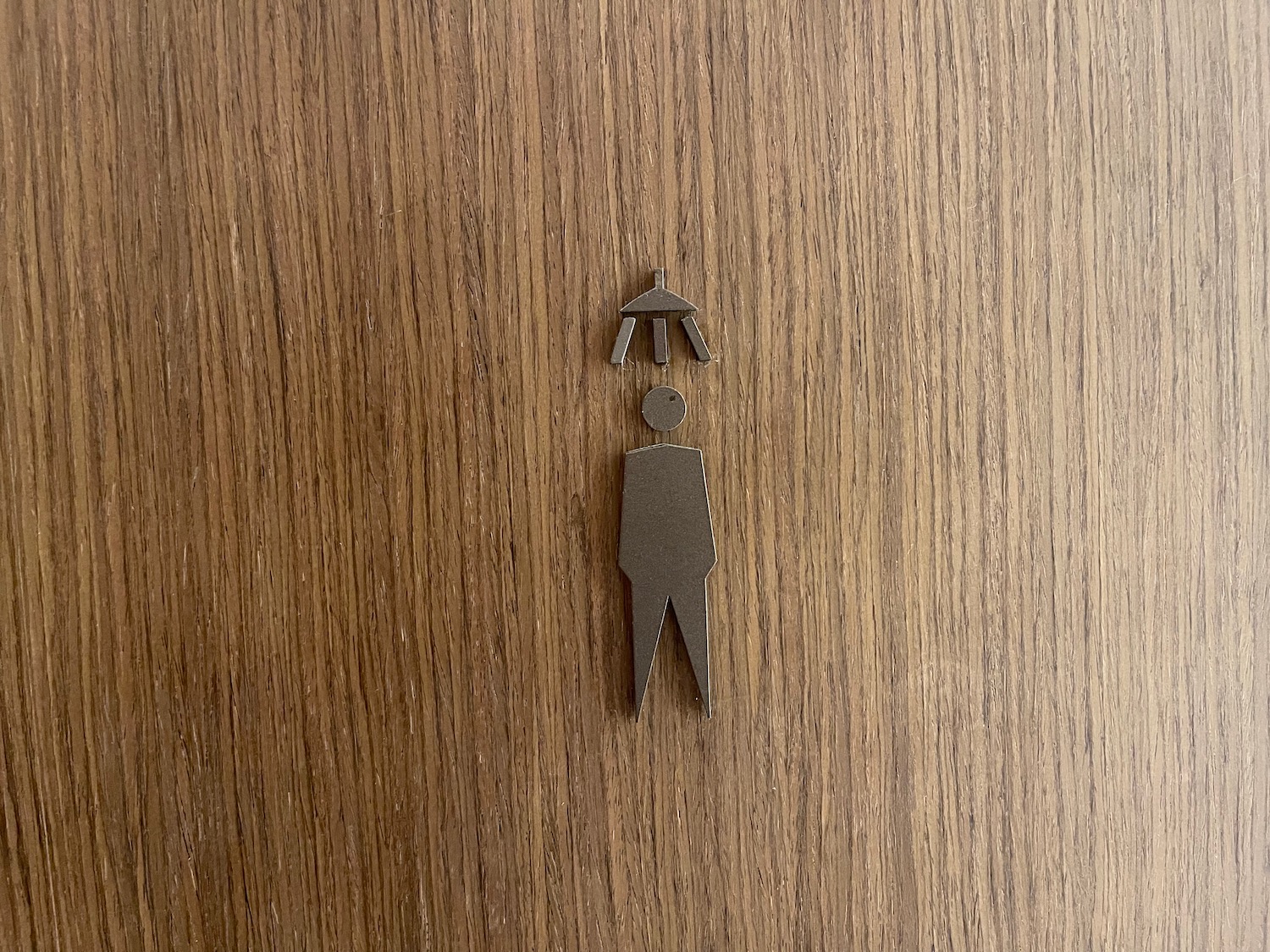 a cut out of a person with a umbrella over his head