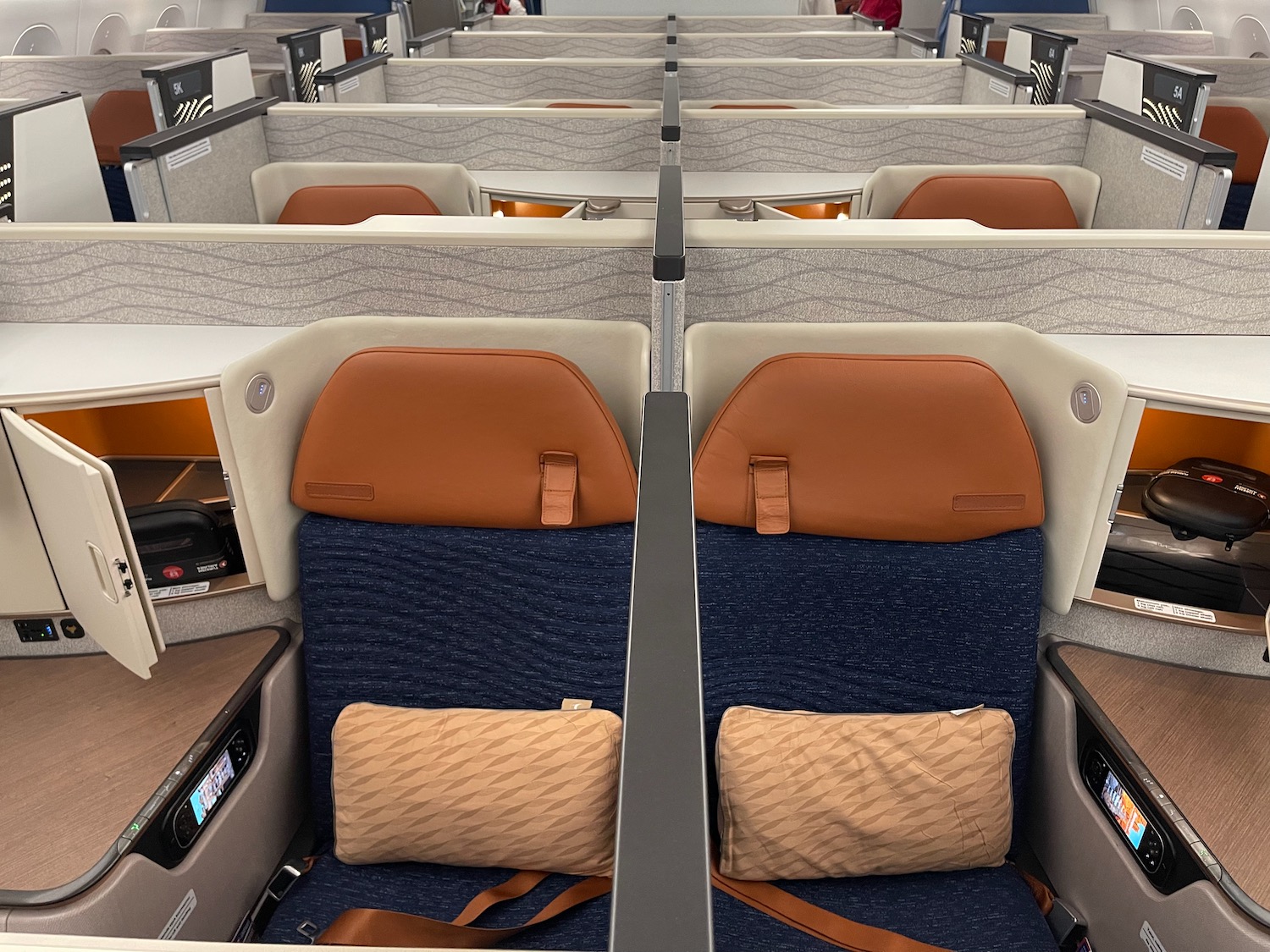 seats in a plane with chairs and tables