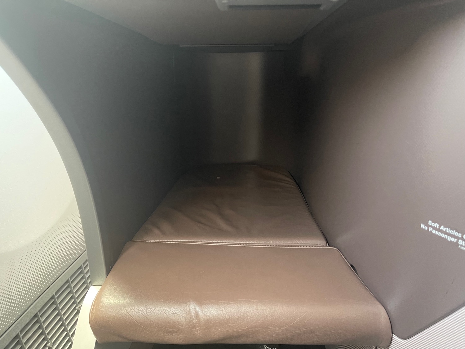 a brown leather seat in a room