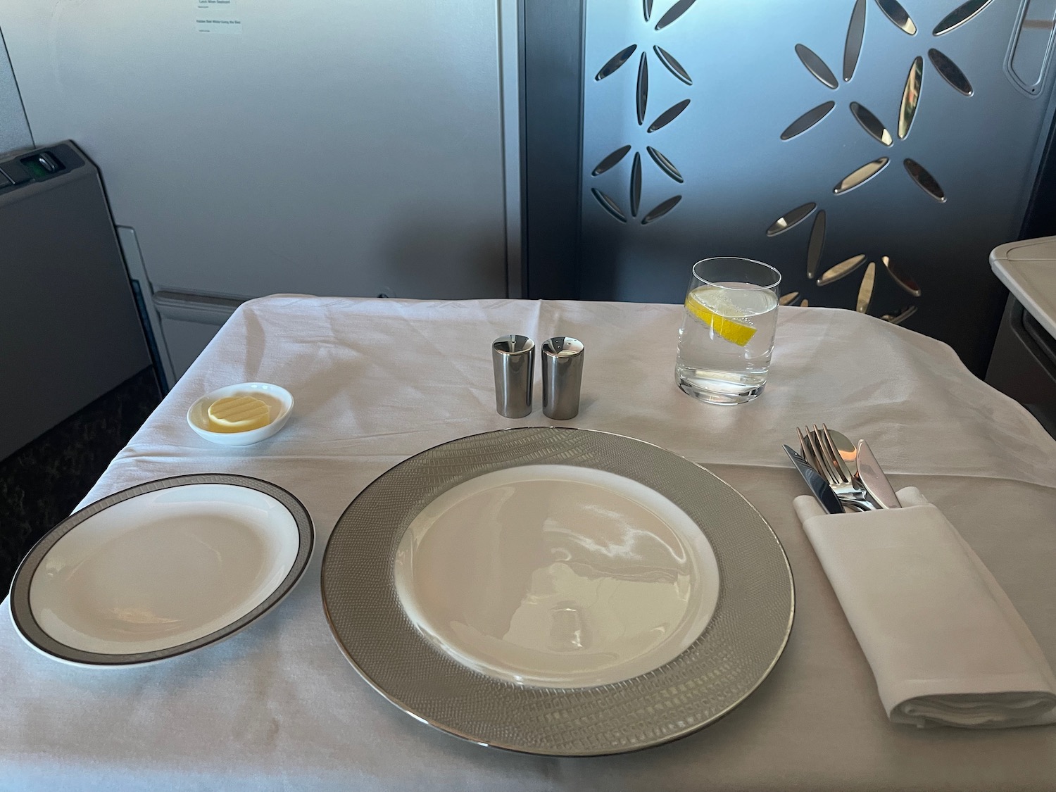 a table with plates and a glass of water