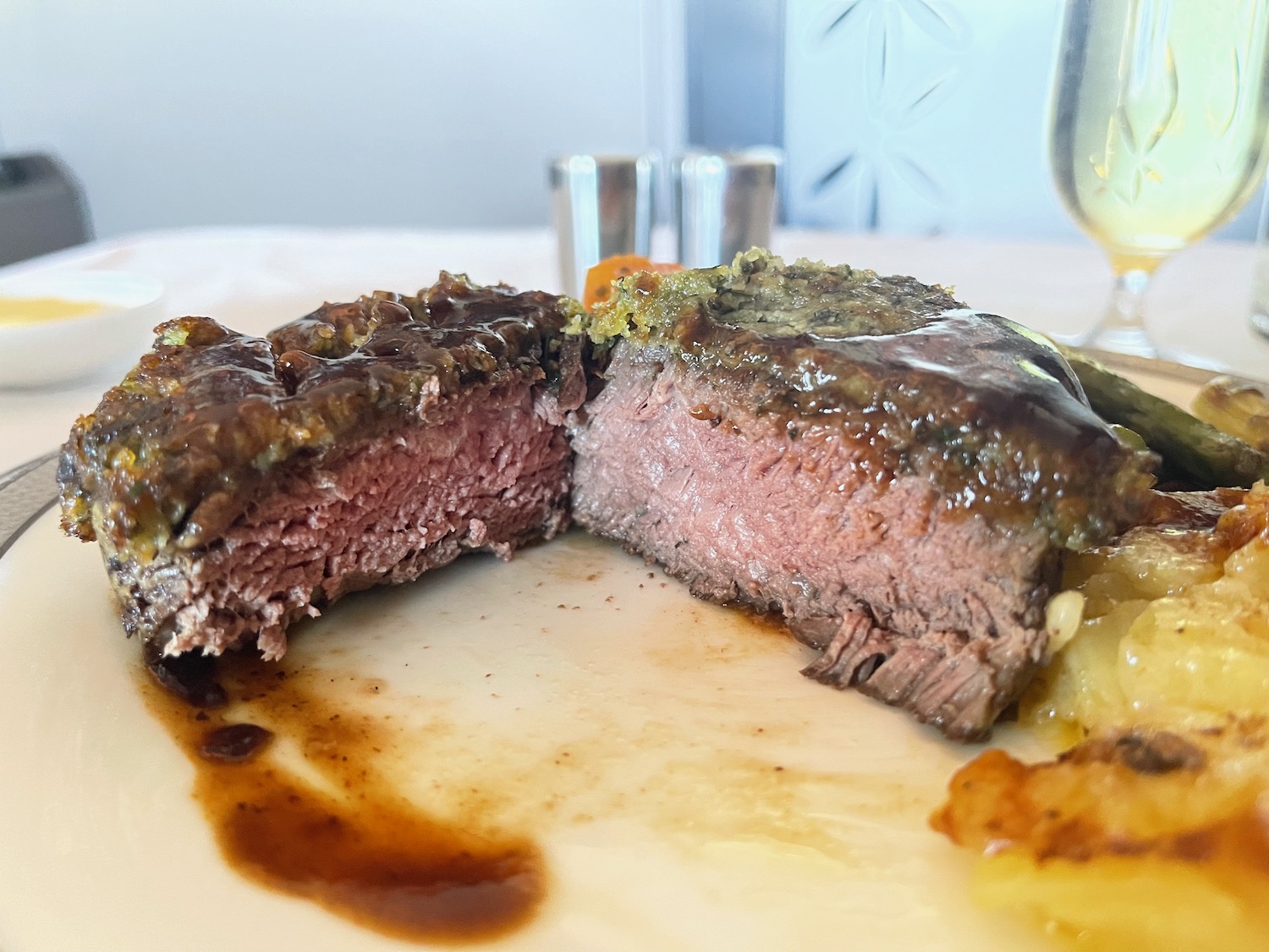 a steak cut in half on a plate