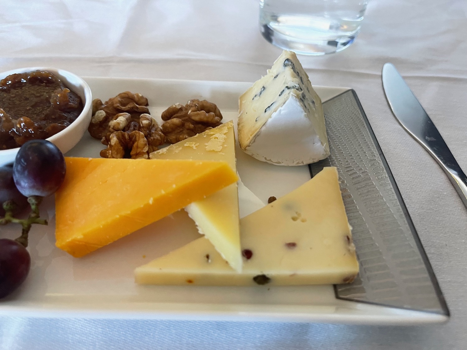 a plate of cheese and fruit