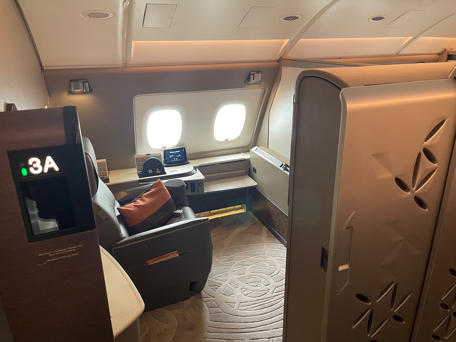 an airplane with a seat and a desk