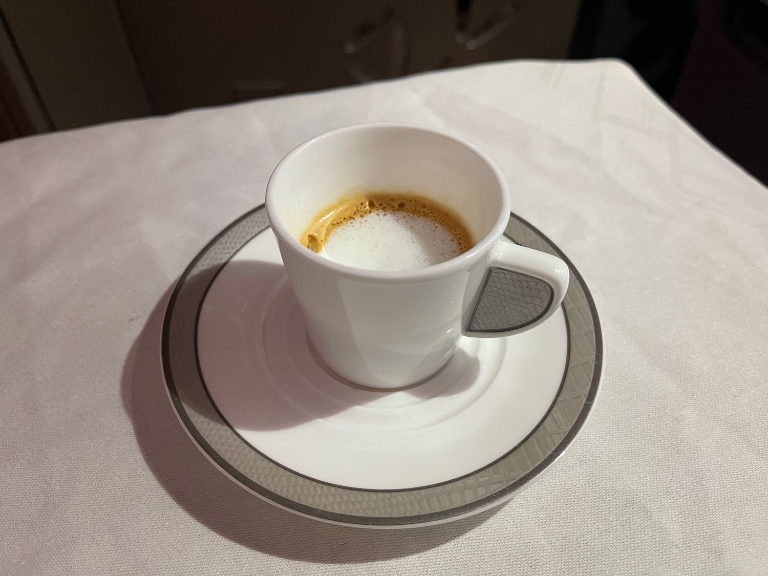 a cup of coffee on a saucer