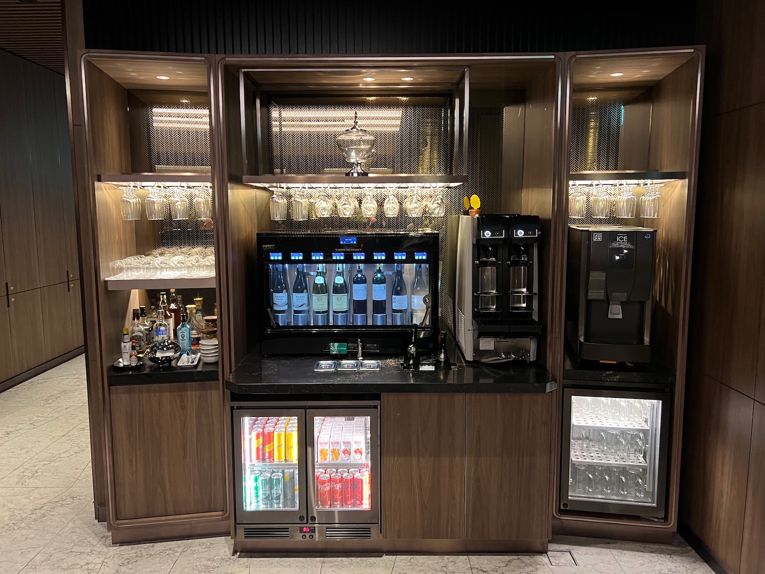 a beverage dispenser and drinks in a room