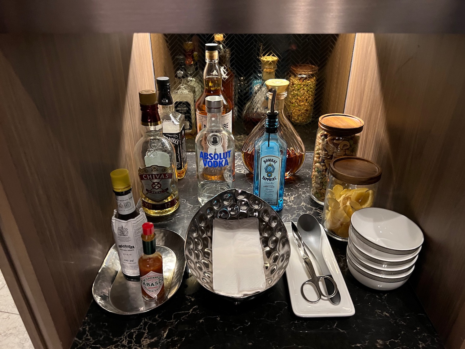 a group of bottles and bowls on a counter