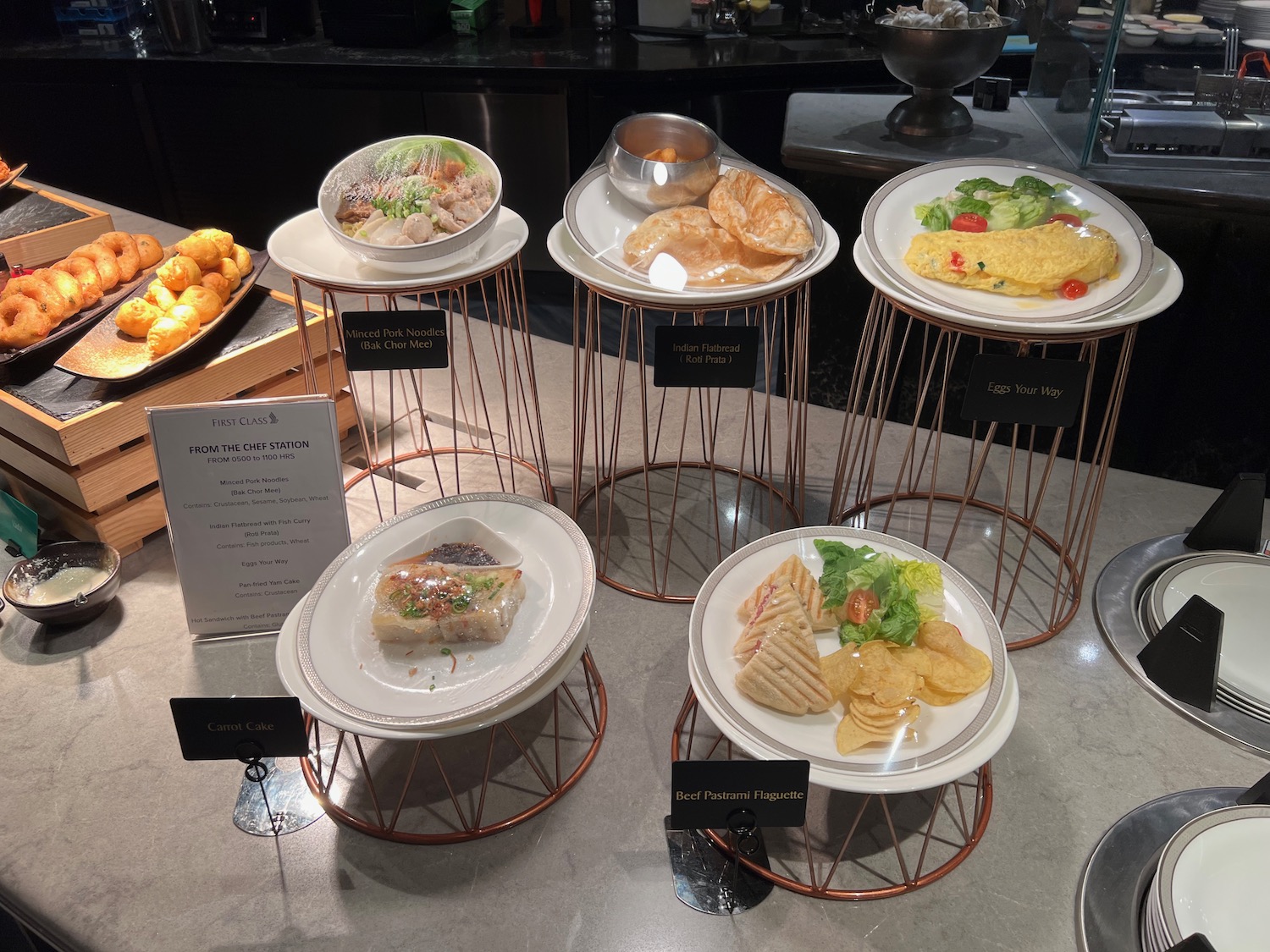 a group of plates of food on display