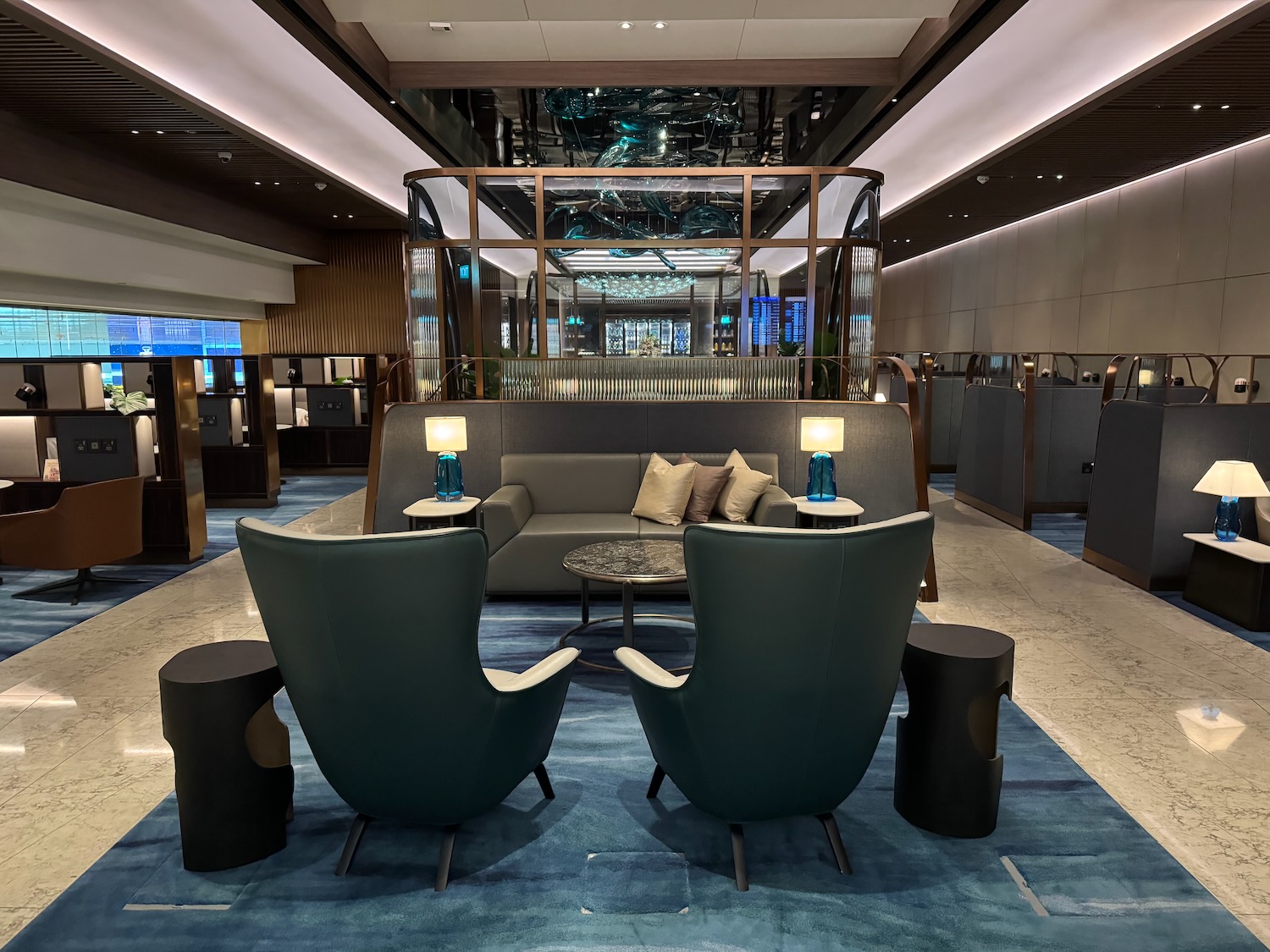 a room with a couch and chairs