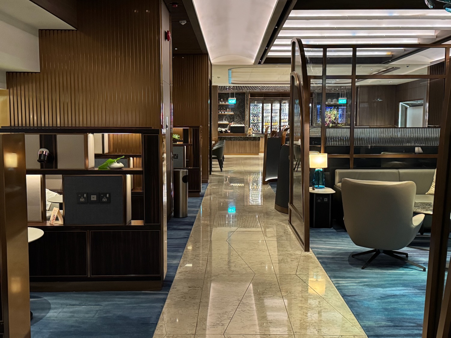 a lobby with a glass door and a glass wall